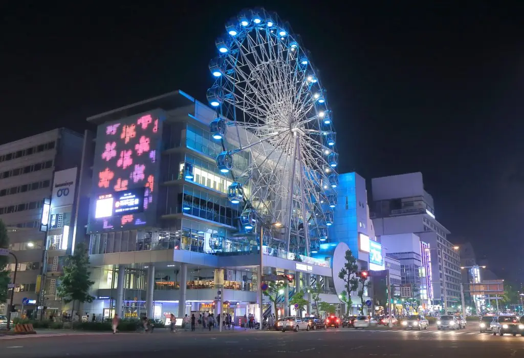 Nagoya Japan - 31 May, 2014: Tourists and local people visit Sunshine Sakae Shopping Centre and Ferris wheel by night in Sakae downtown Nagoya Japan.