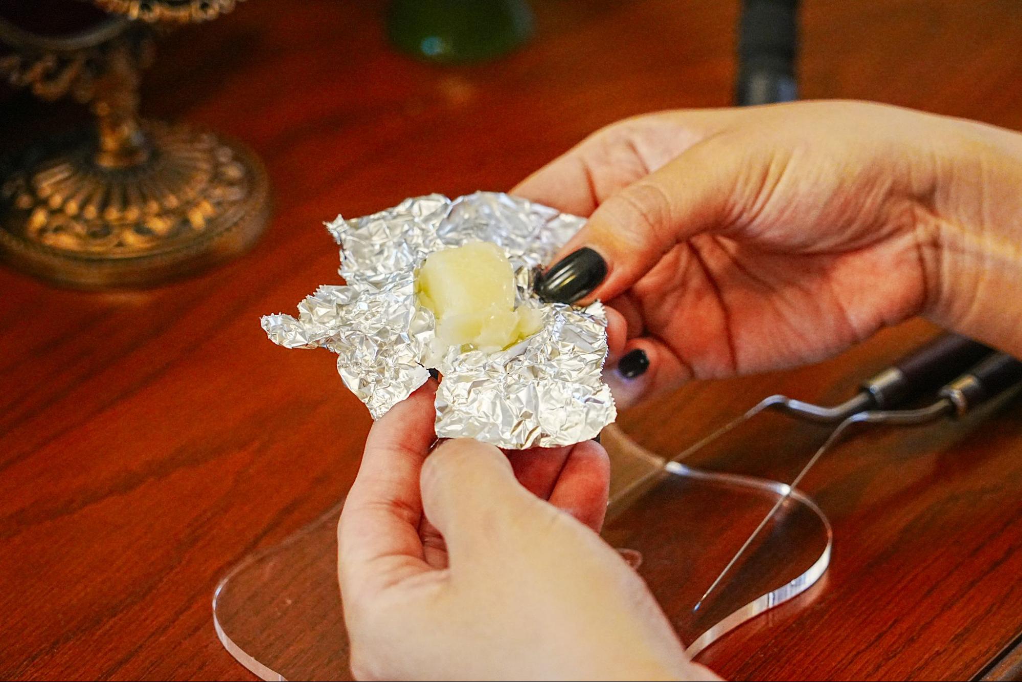 Remove the balm from the aluminum foil